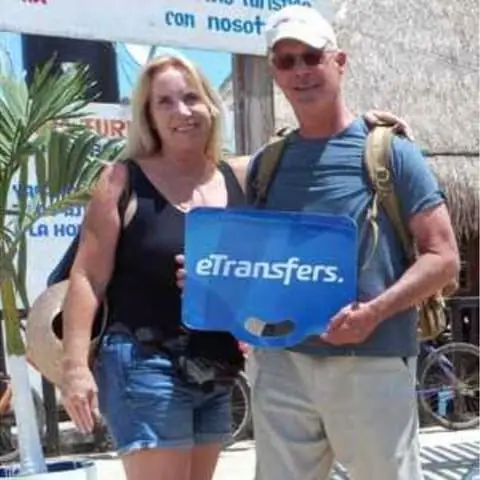 James P. holding an eTransfers sign